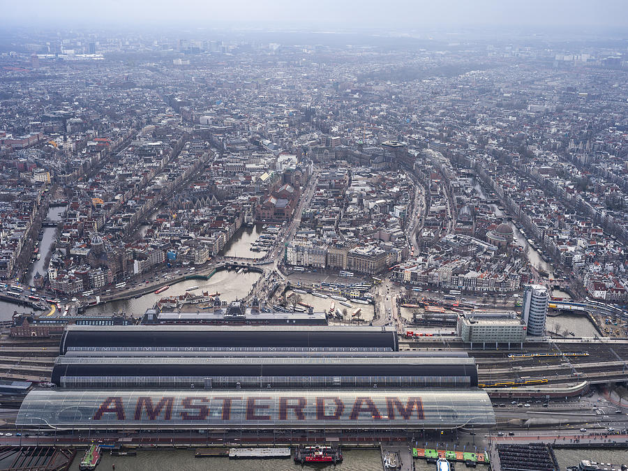 Aerial flying over Amsterdam train station Photograph by Nisian Hughes