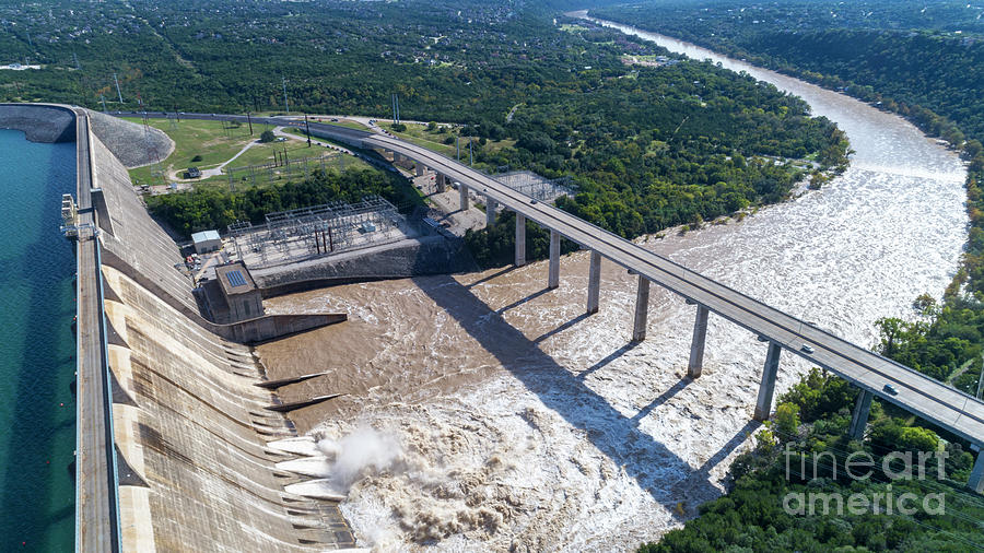 Aerial image of Lake Travis Mansfield Dam with four floodgates open ...