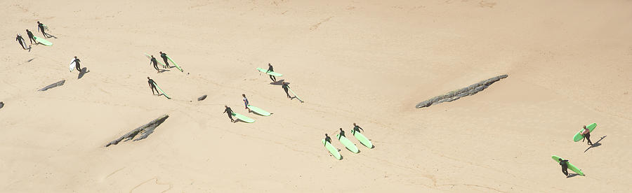 Aerial image of longboard surf group walking on the beach  Photograph by Jean-Luc Farges