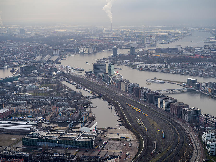 Aerial looking at Amsterdam center over train tracks Photograph by Nisian Hughes