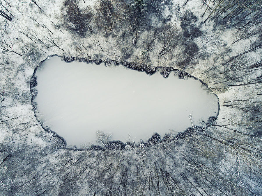Aerial of frozen pond with first ice during Winter Photograph by Matt Champlin