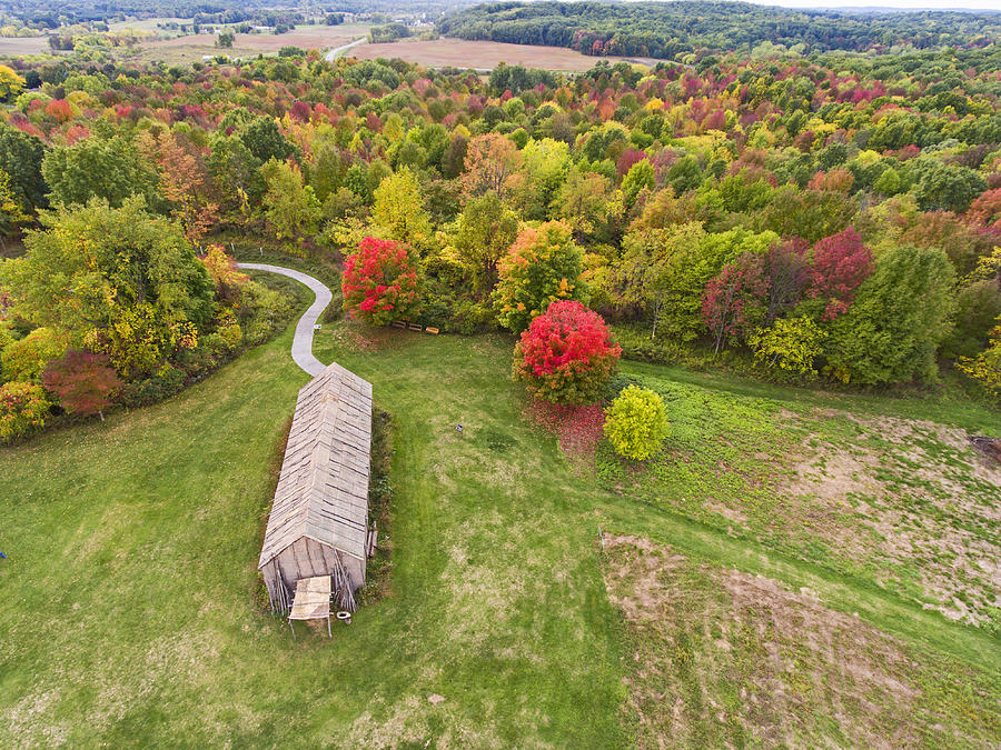 Aerial of reconstructed Iroquois Longhouse Photograph by Matt Champlin