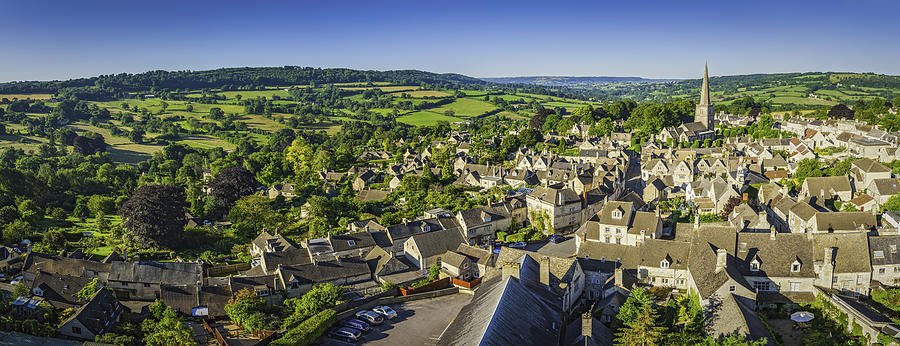 Aerial panorama over idyllic country village cottages green summer fields Photograph by fotoVoyager