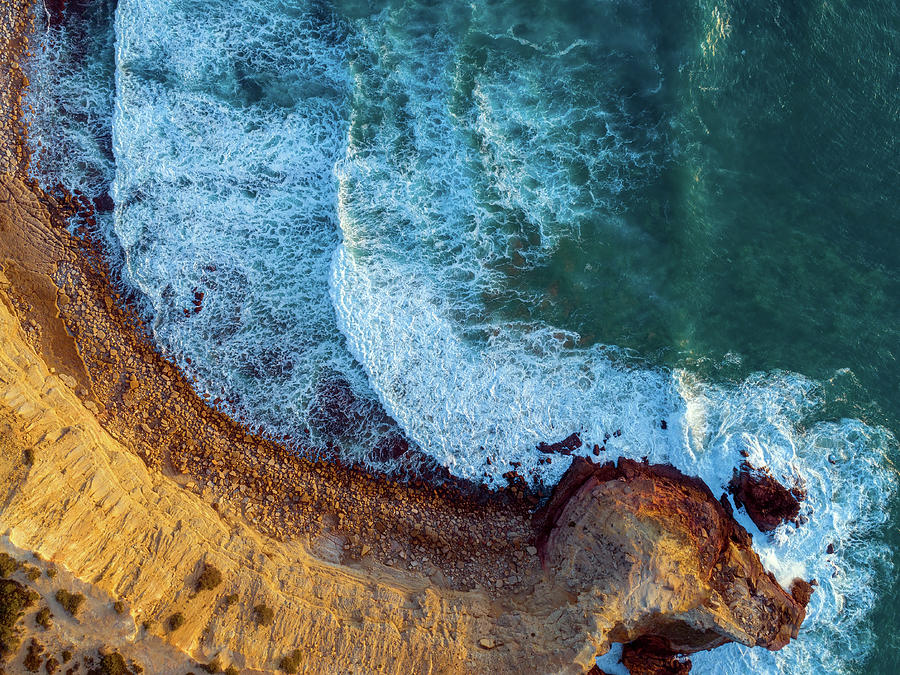 Aerial top view on rock cliffs and waves Photograph by Mikhail Kokhanchikov
