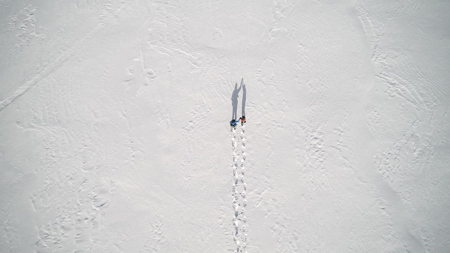 Aerial View Family Snowshoeing Outdoor in winter Photograph by Onfokus