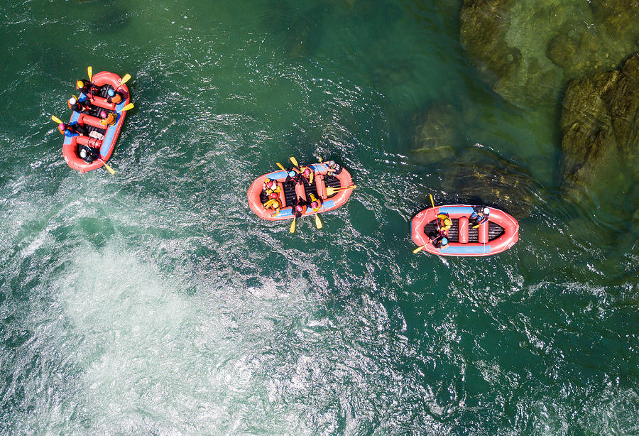 Aerial view of a group of men and women white water river rafting Photograph by Tdub303
