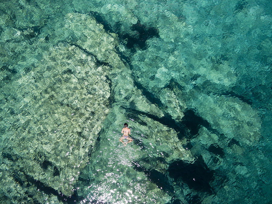 Aerial view of a young woman snorkelling - Mljet National Park, Croatia Photograph by Joao Inacio