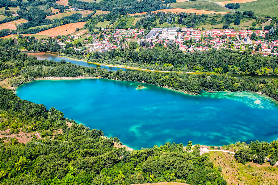Aerial view of beautiful lake with Ain river in background in France with town in lush foliage countryside in summer Photograph by Gregory_DUBUS