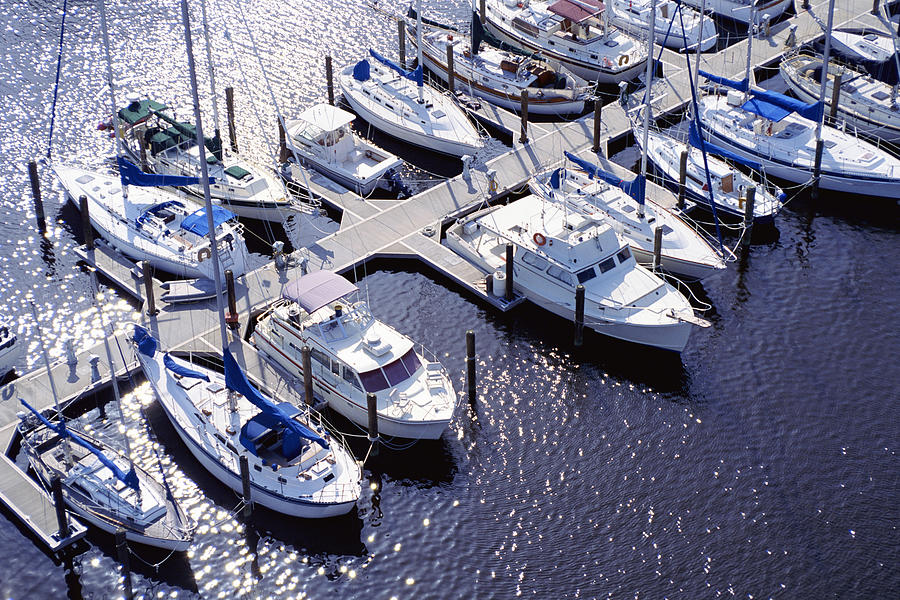 Aerial view of boats in marina Photograph by Jupiterimages