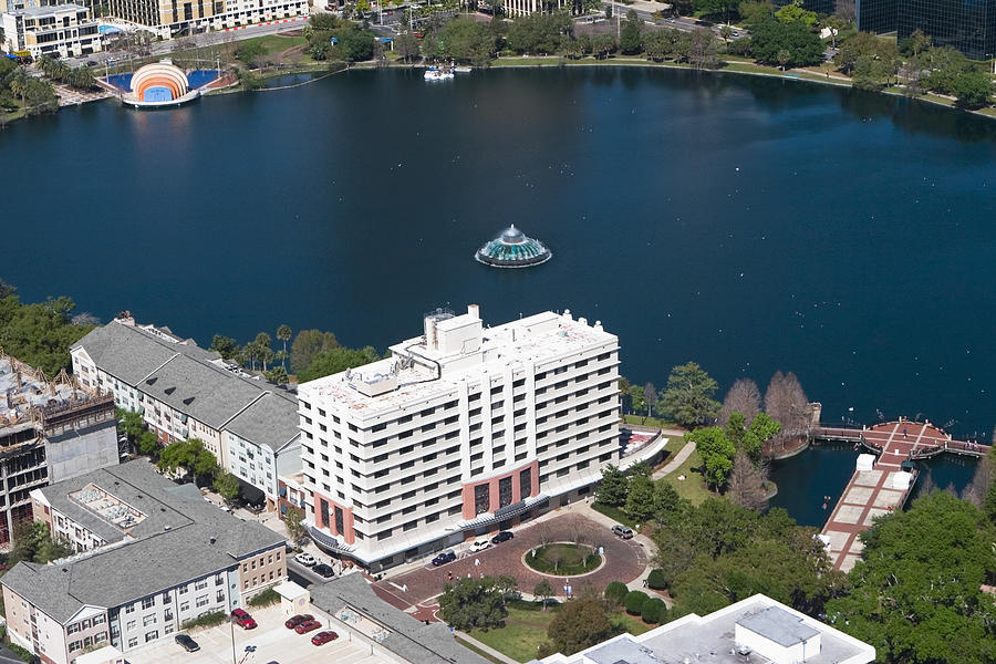 Aerial view of buildings along a lake, Lake Eola, Lake Eola Park, Orlando, Florida, USA Photograph by Glowimages