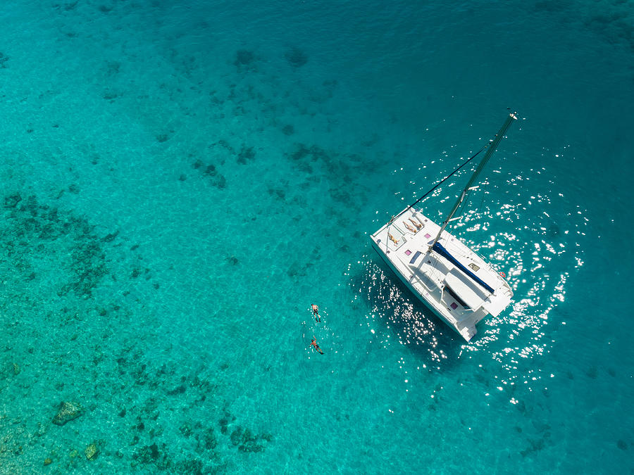 Aerial view of catamaran anchored in tropical Caribbean Photograph by Cdwheatley