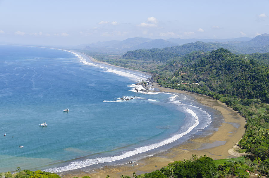 Aerial view of fishing boats and coastline. Dominical, Costa Rica Photograph by OGphoto