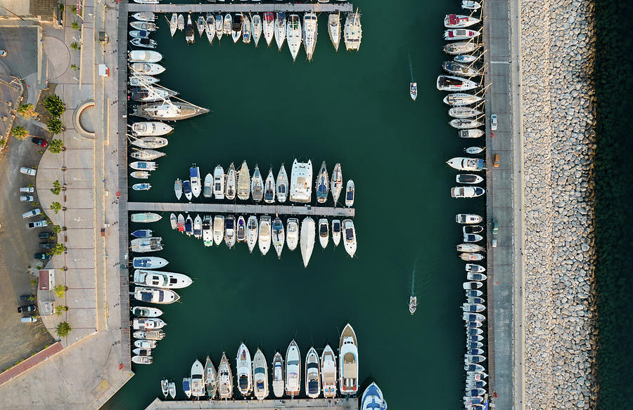 Aerial view of fishing boats and tourist yachts moored at the marina. Latsi harbor Paphos Cyprus Photograph by Michalakis Ppalis