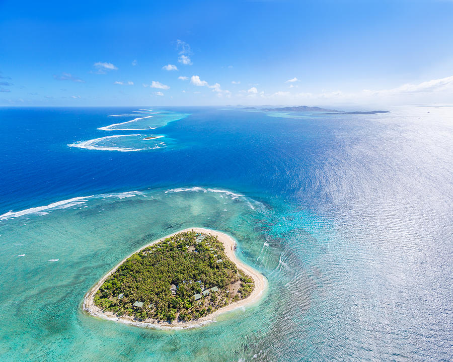 Aerial view of heart shaped island Tavarua, Fiji Photograph by Matteo Colombo