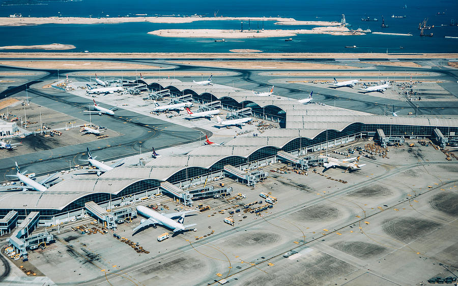 Aerial view of Hong Kong International Airport with planes parking on the tarmac Photograph by D3sign