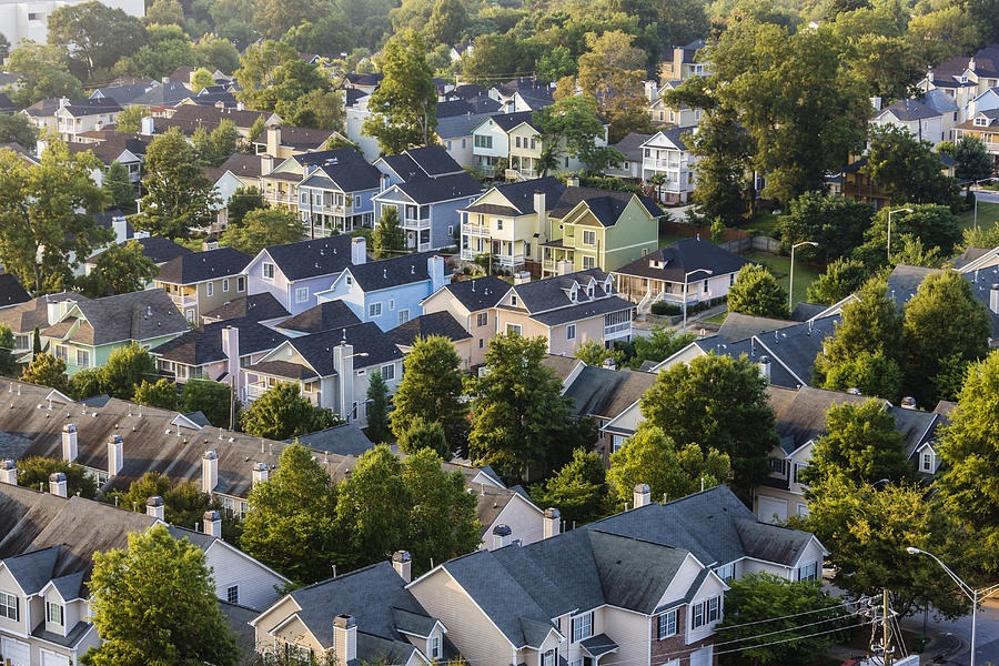 Aerial view of house roofs in suburban neighborhood Photograph by Jeremy Woodhouse