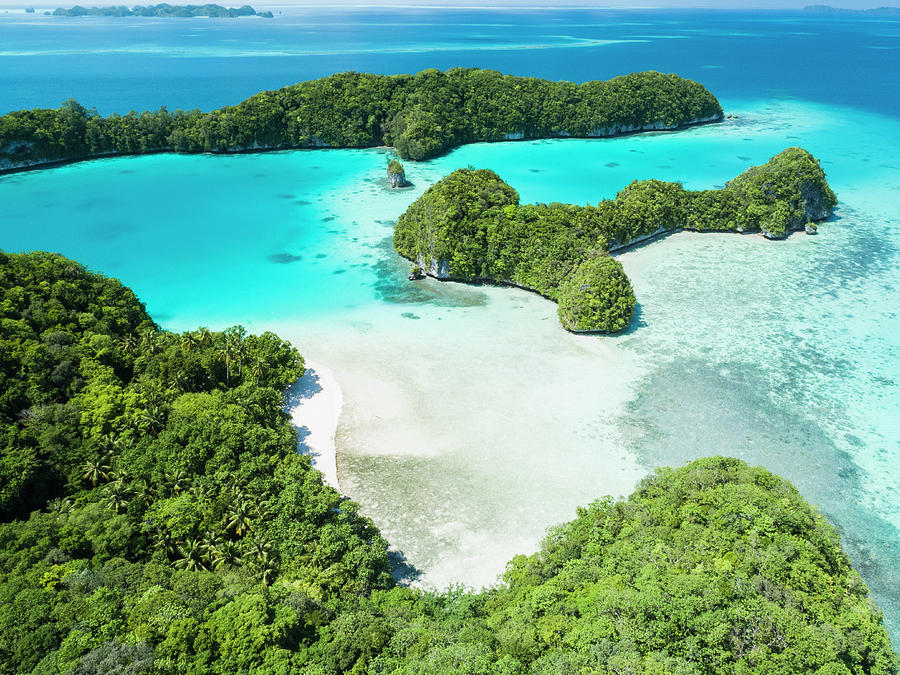 Aerial view of jungle covered limestone islands in Palau with lagoon ...