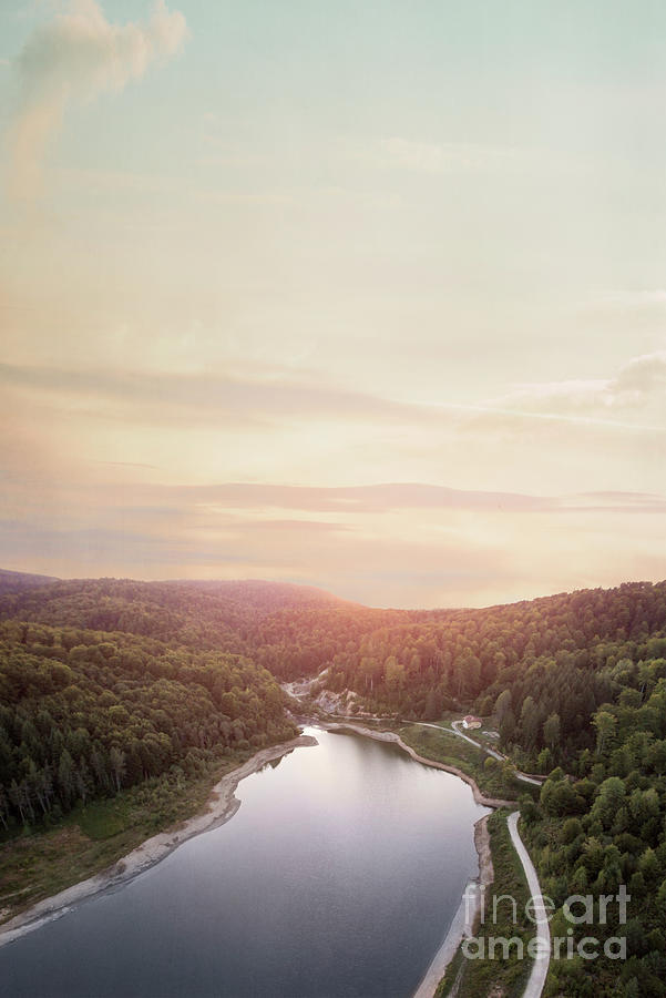 Aerial view of lake in forest at sunset Photograph by Jelena Jovanovic