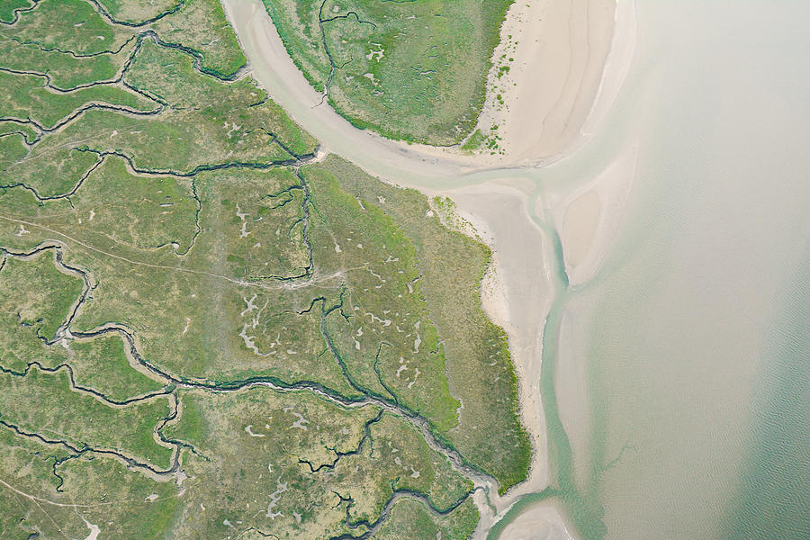Aerial view of marshes and shoreline in Wales Photograph by Luke Stanton