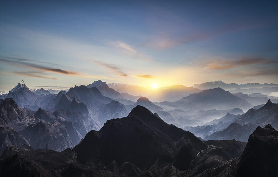 Aerial view of misty mountains at sunrise Photograph by Guvendemir