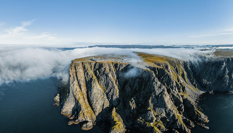Aerial view of North Cape aka Nordkapp in summer with fog clouds