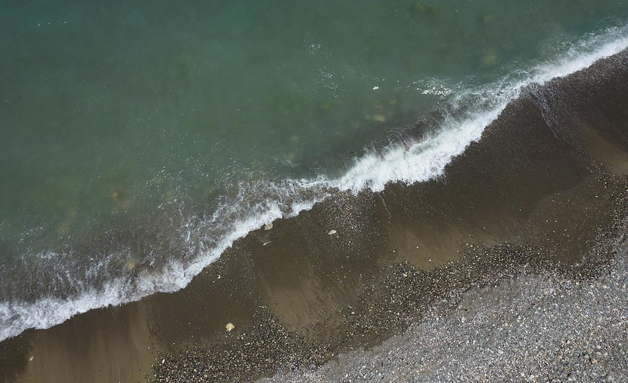 Aerial View Of Ocean Waves Braking On A Sandy Beach. Nature Background Photograph