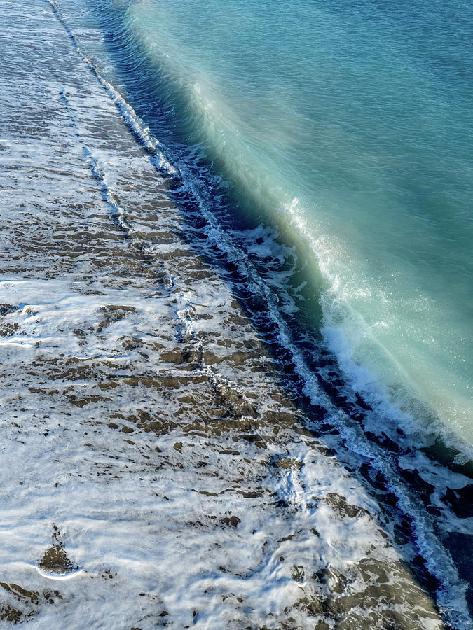 Aerial view of ocean waves breaking on a sandy beach. Nature background Photograph by Michalakis Ppalis