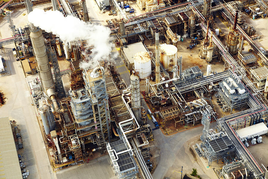 Aerial view of oil refinery Photograph by Thomas Northcut