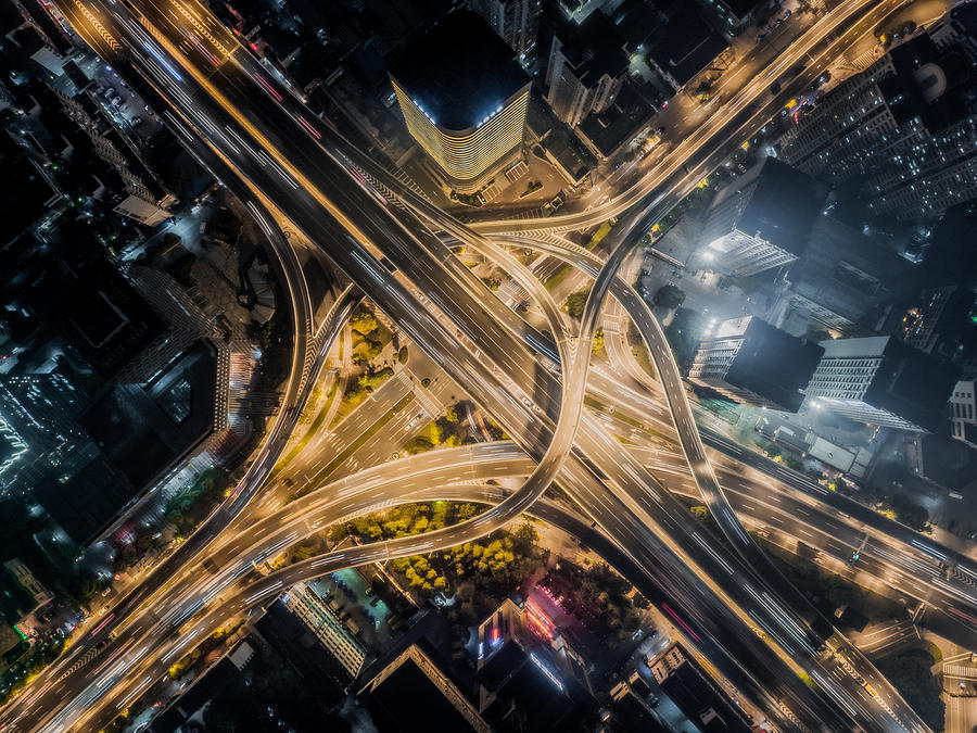 Aerial view of road interchange at night Photograph by Sino Images