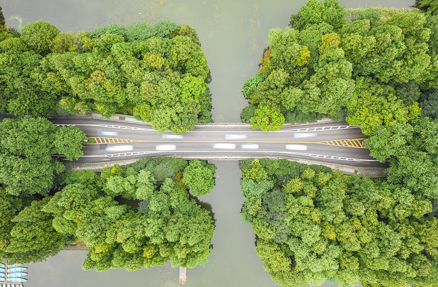 Aerial view of road over West Lake Photograph by Liyao Xie