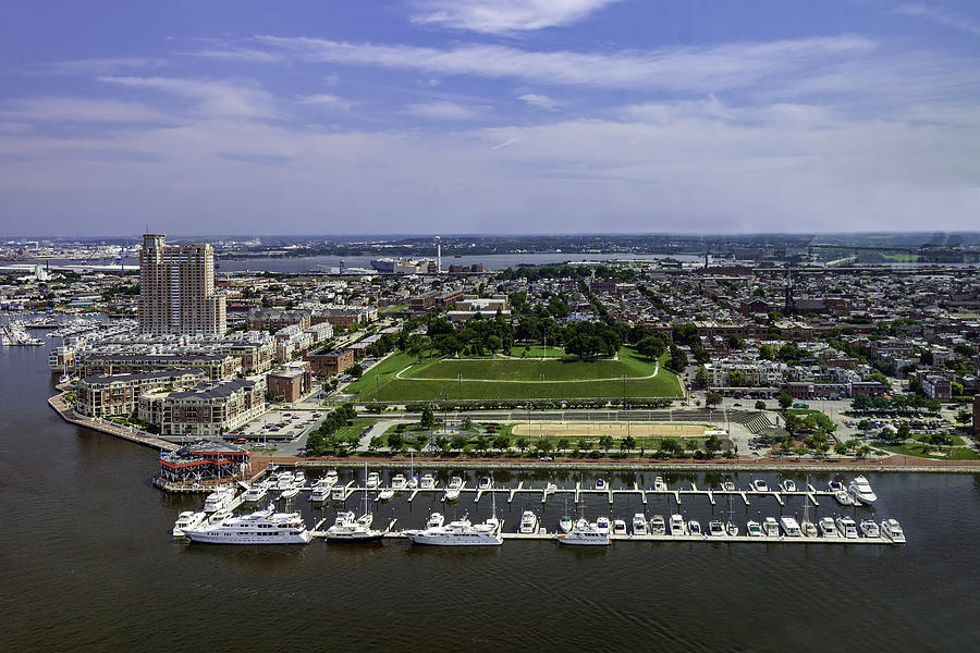 Aerial view of the Baltimore Inner Harbor, the homes and Condominiums overlooking a Marina, and the famous Federal Hill Park in Baltimore, Maryland Photograph by VisionsbyAtlee