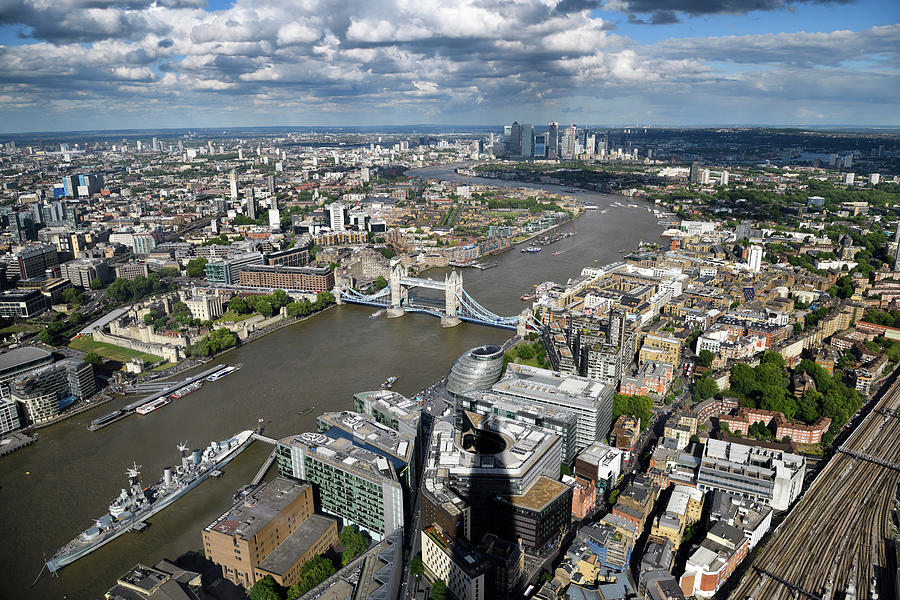 Aerial view of the muddy River Thames with HMS Belfast, Tower of ...