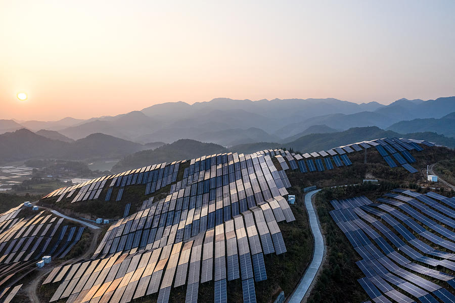 Aerial view of the solar power plant on the top of the mountain at sunset Photograph by Zhihao