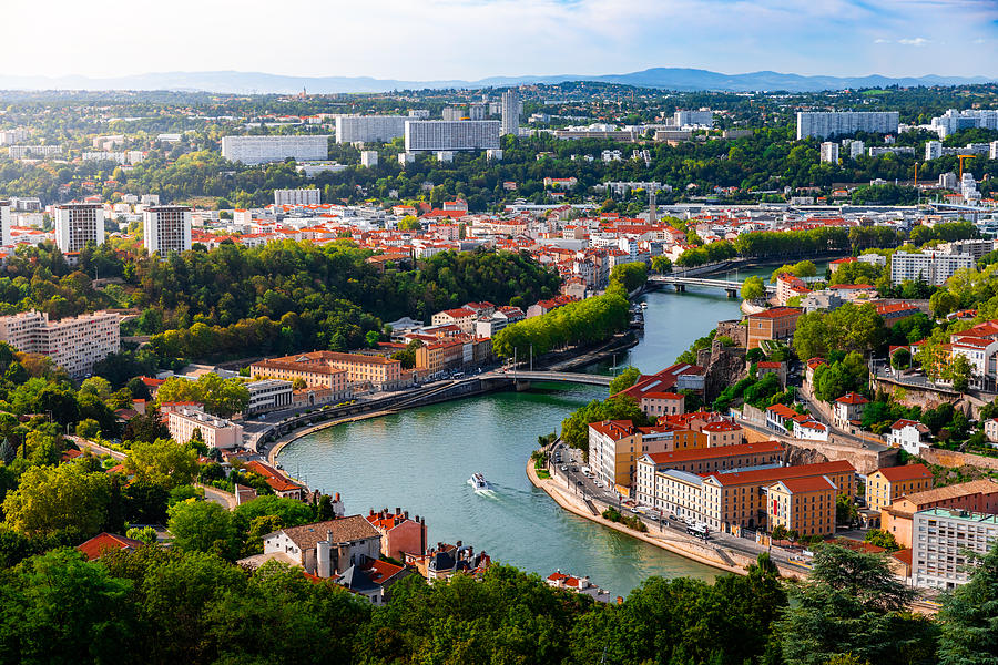 Aerial view of the suburbs of Lyon French city along Saone river with some residential buidings and boats sailing Photograph by Gregory_DUBUS