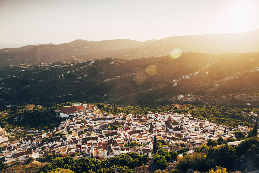 Aerial view over Frigiliana hill town at sunset Photograph by Gary Yeowell