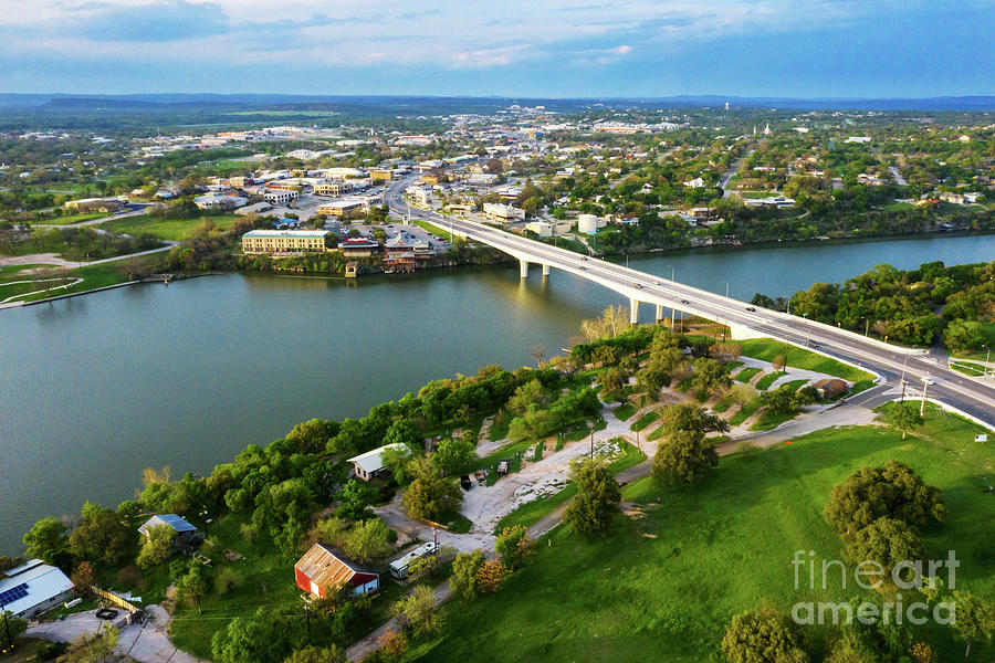 Summer Photograph - Aerial view overlooking the bridge over Lake Marble Falls and town of Marble Falls, Texas by Dan Herron