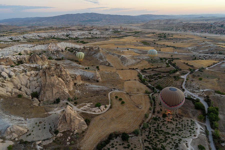 Aerial wide angle Panoramic view with hot air balloons flying over Cappadocia, Central Anatolia, Turkey, at sunrise. Photograph by Arpan Bhatia