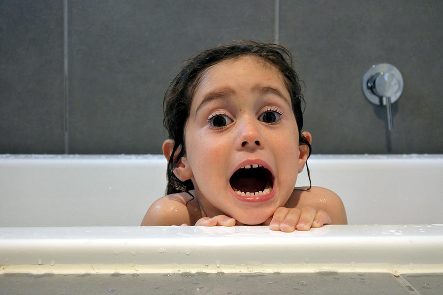 Afraid young girl having a bath Photograph by Rafael Ben-Ari