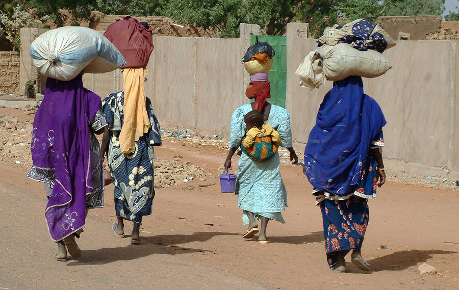 Africa, North Africa, Niger, View Of Women Walking Carrying Sacks On Head (Year 2007) Photograph by Kypros