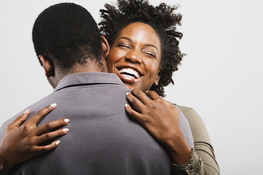 African American couple hugging Photograph by Hill Street Studios