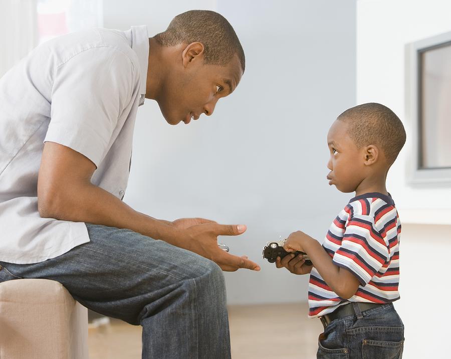 African American father talking to son Photograph by Jose Luis Pelaez Inc