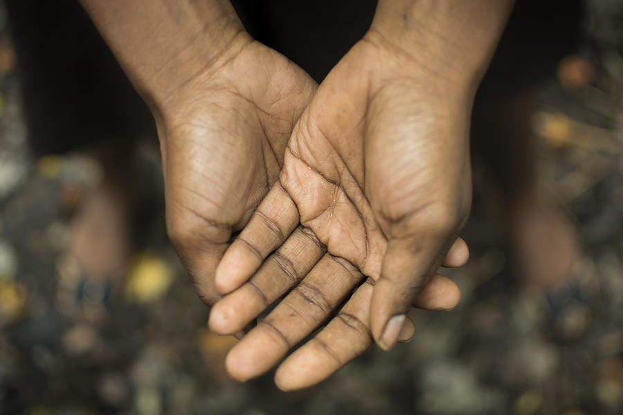African American hands held together Photograph by Mzajac