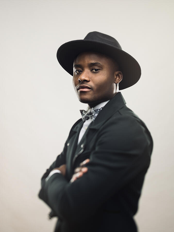 African american man posing in black jacket and hat Photograph by SensorSpot