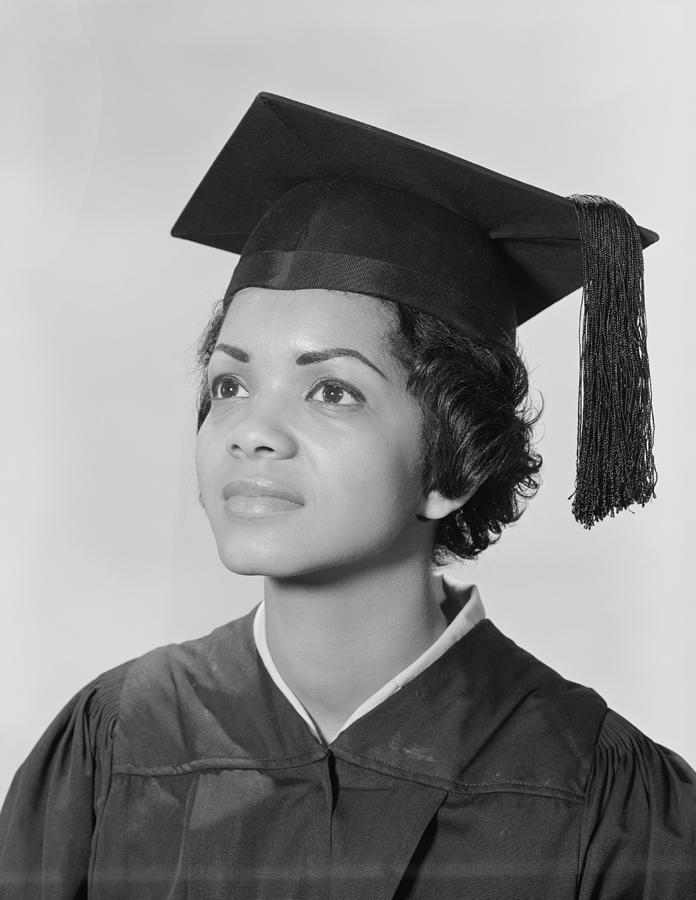 African-American woman in cap and gown, portrait. Photograph by H. Armstrong Roberts