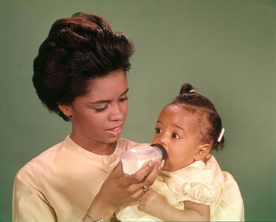 African-American Woman Mother Feeding Baby With Bottle Babies Women Mothers Family Families Parenting. Photograph by H. Armstrong Roberts