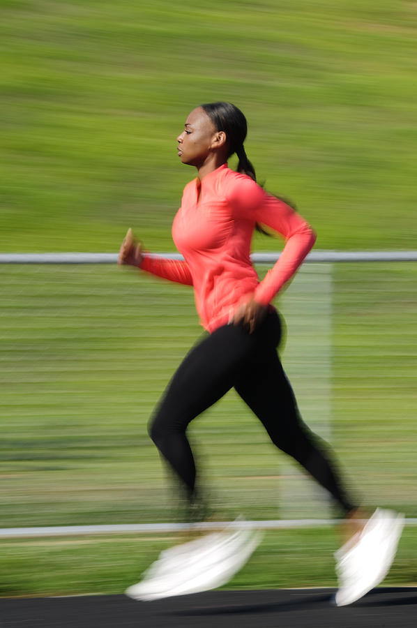 African American woman running Photograph by OGphoto