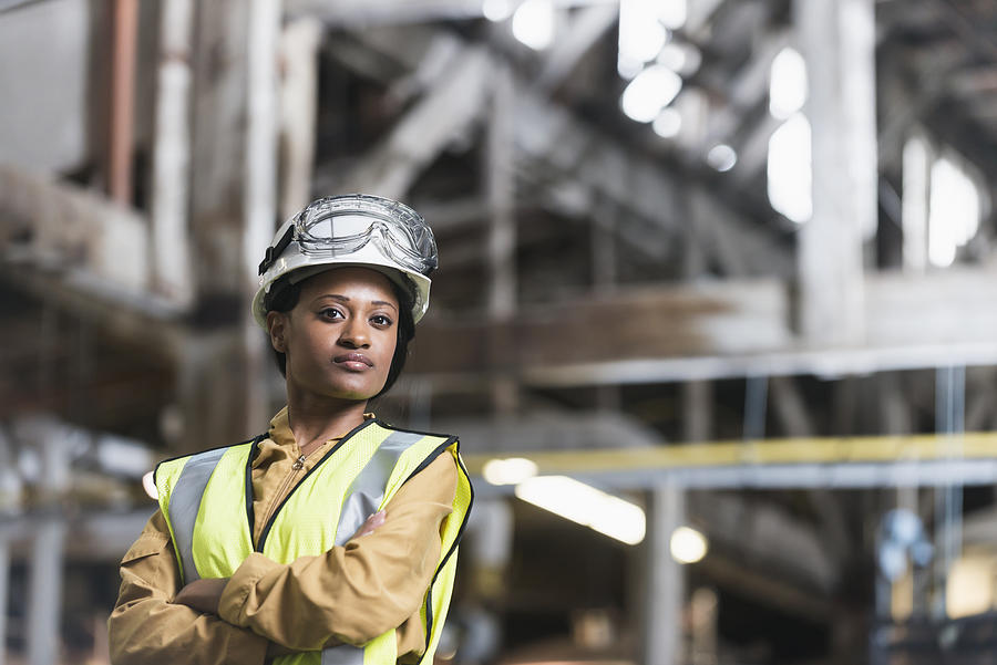 African American woman wearing hardhat and safety vest Photograph by Kali9