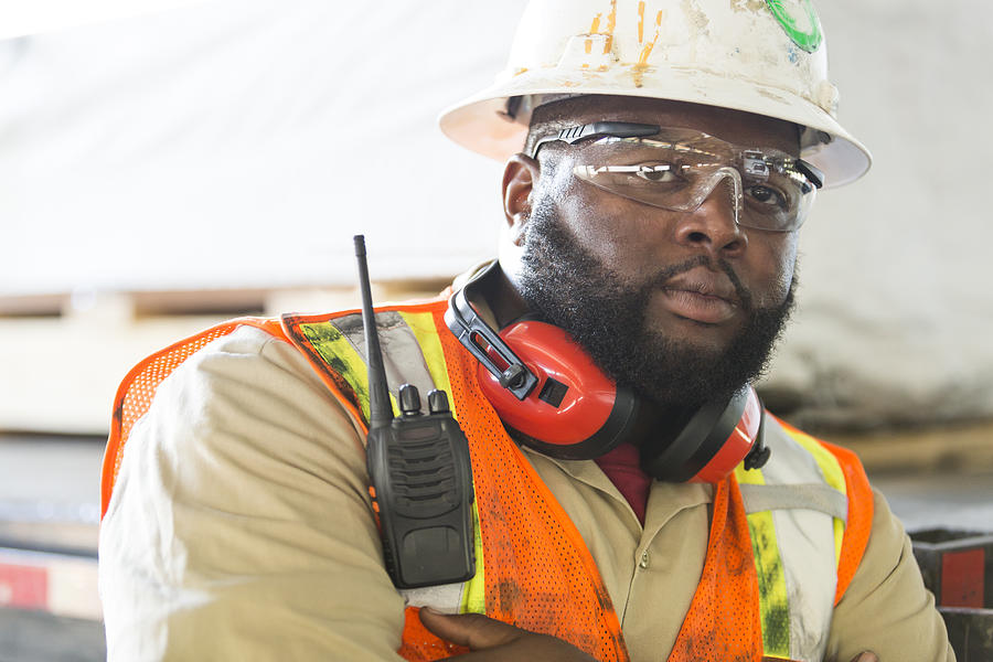 African-American worker in hardhat, reflective vest Photograph by Kali9