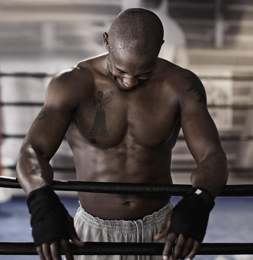 African boxer in boxing ring laughing Photograph by Hill Street Studios