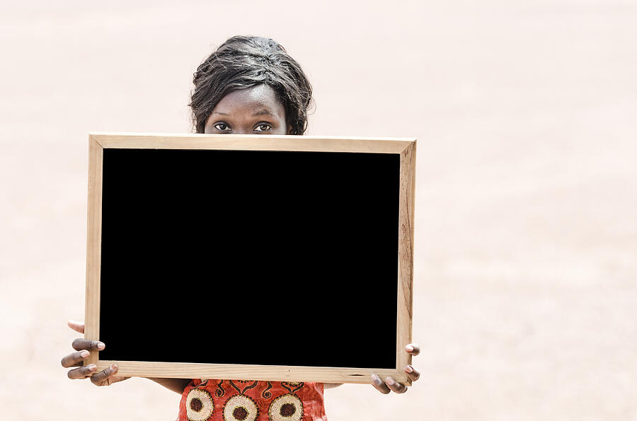 African Ethnicity Mature College Student Holding and Showing Blackboard (Mali) Photograph by Borgogniels